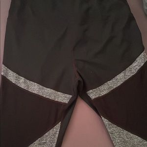Black/grey/white workout pants with mesh fabric along the thighs.